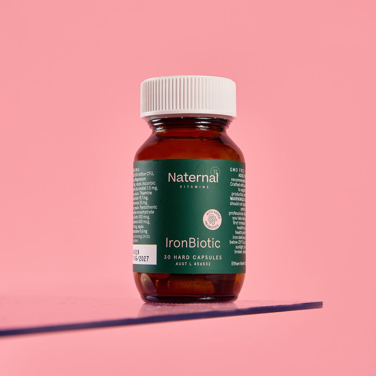 Bottle of Naternal IronBiotic on a pink background